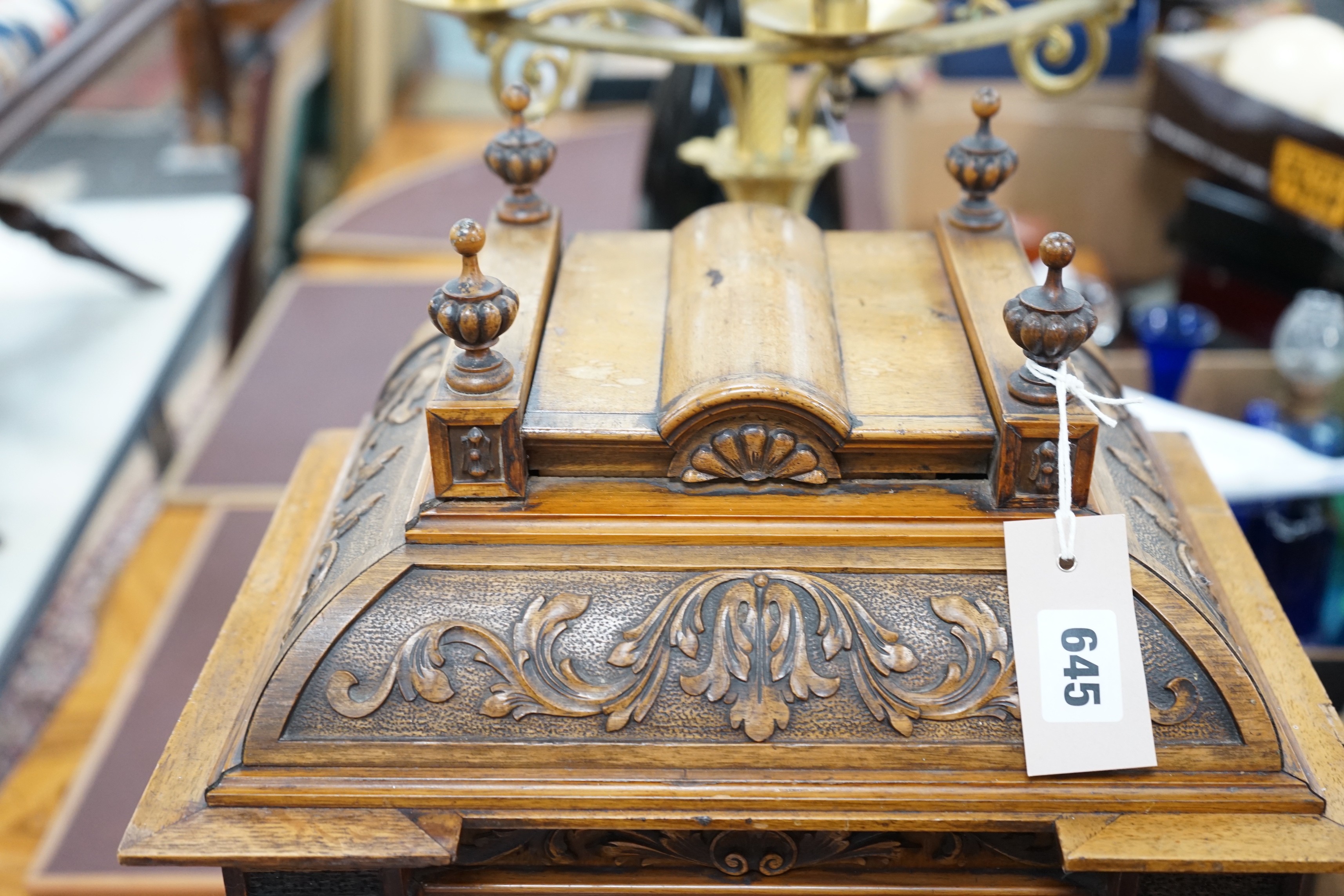 A 19th century architectural walnut bracket clock, with key and pendulum. 53cm tall